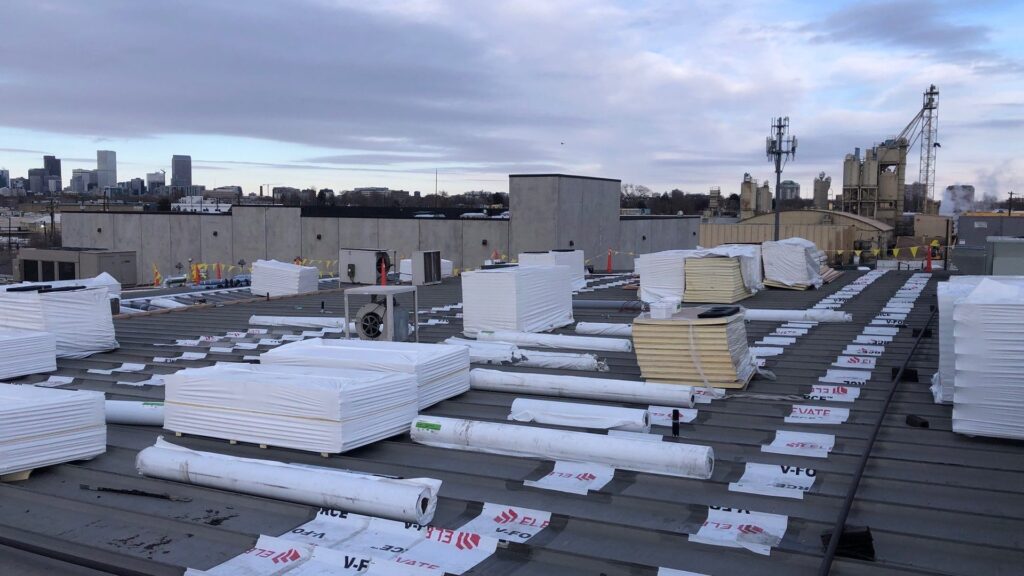 Approved commercial roofing job showing membrane and flashing work