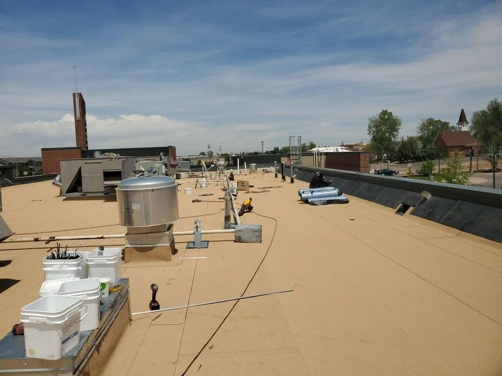 Modified bitumen commercial roof coating application with buckets and roofing tools